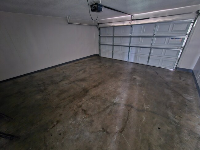 Building Photo - PREMIUM RENTAL! 3BR/2BA | Stone Fireplace & Hardwoods | Fenced Yard!
