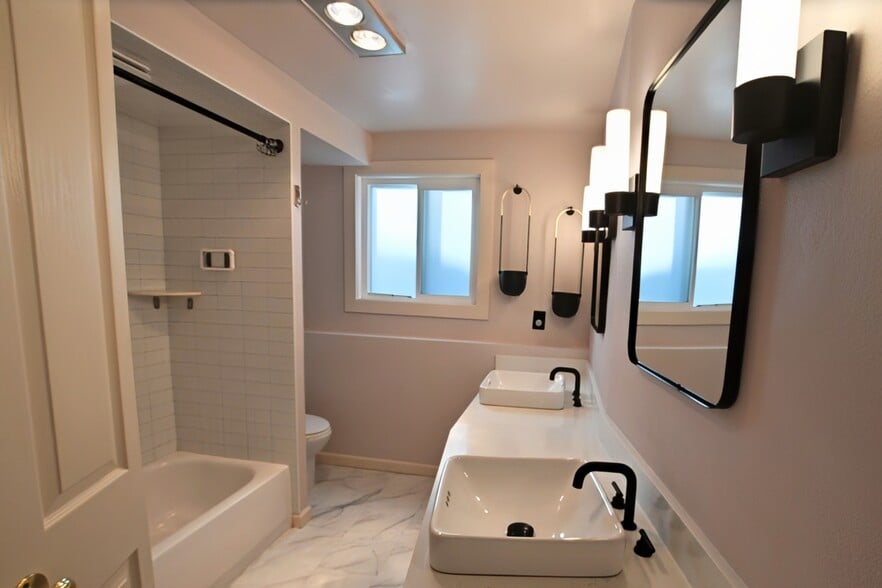 Bathroom with tub and dual vanity - 3711 26th Pl W