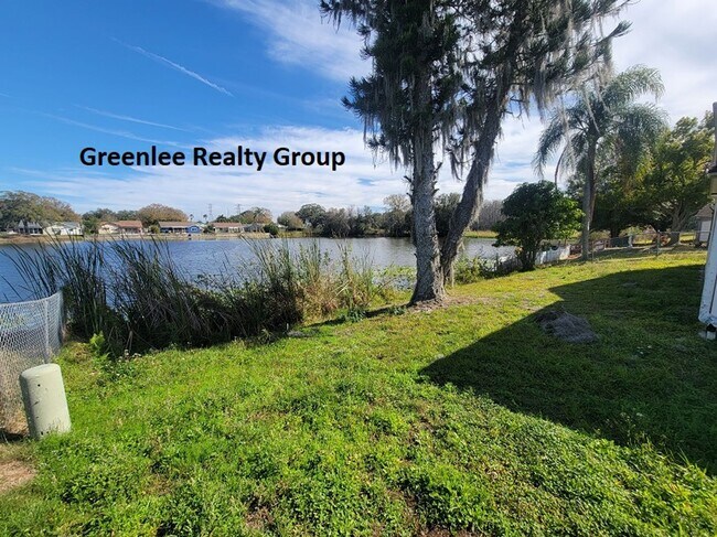 Building Photo - Relax by the water in this spacious 2-bedroom home with a 2-car garage, nestled in the highly des...