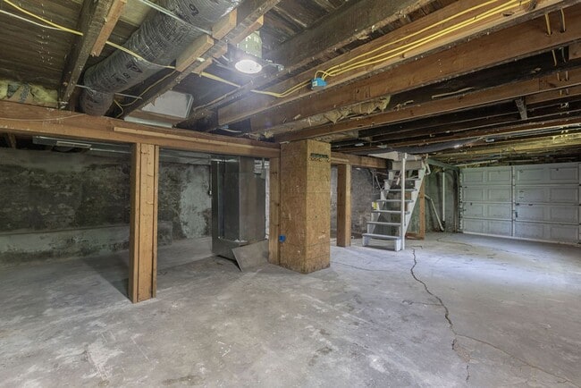 Building Photo - Remodeled 2-Bedroom Bungalow with Spacious Yard & 1-Car Basement Garage