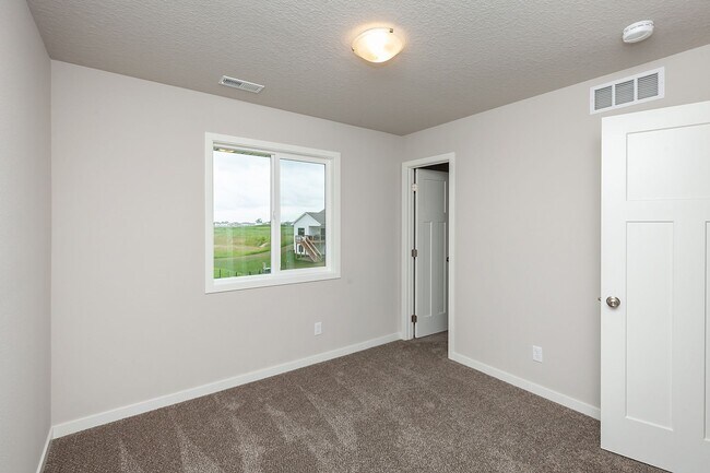 Building Photo - Prime Living: A Spacious Haven with Fenced Backyard in Ankeny