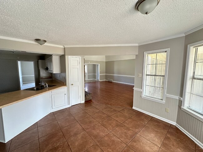Building Photo - Grand 4BR/2BA Near Southwind | 2,438 Sq Ft, Stone Fireplace, Soaking Tub & 2-Car Garage