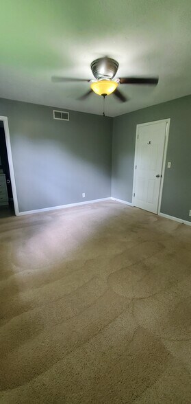 Master bedroom, door to full bathroom. - 313 Britanna Dr