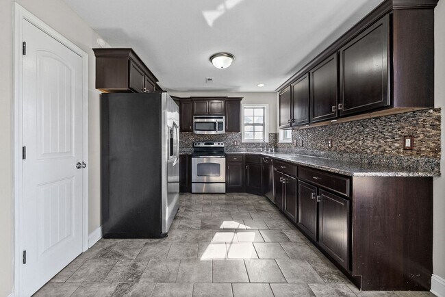 Building Photo - Pet Friendly Four Bedroom with Basement!