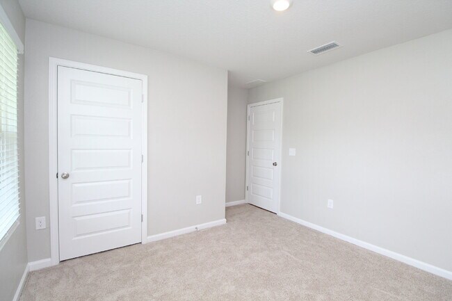 Building Photo - Coming Available Soon – 4BR/2BA Brick Home with Open Floor Plan, Solar Panels & 2-Car Garage in L...