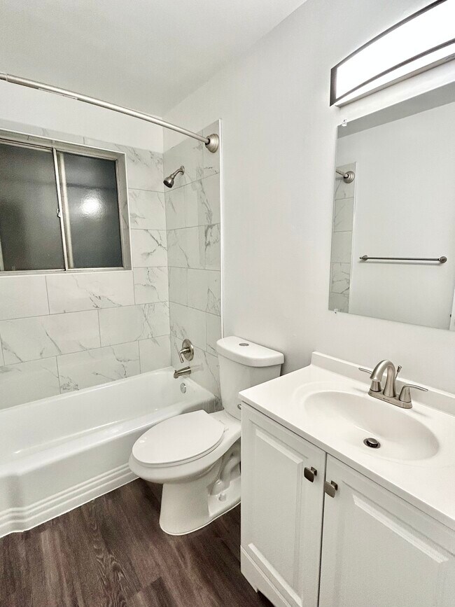 Experience luxury living with this beautifully designed bathroom featuring contemporary finishes. - GRACE LANDINGS APARTMENTS