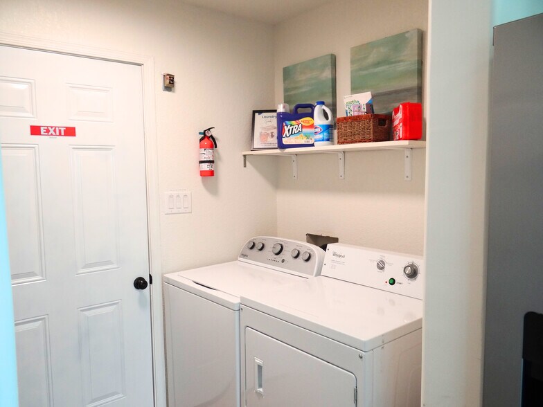 Convenience of washer and dryer inside the home. - 8941 E 24th Ln