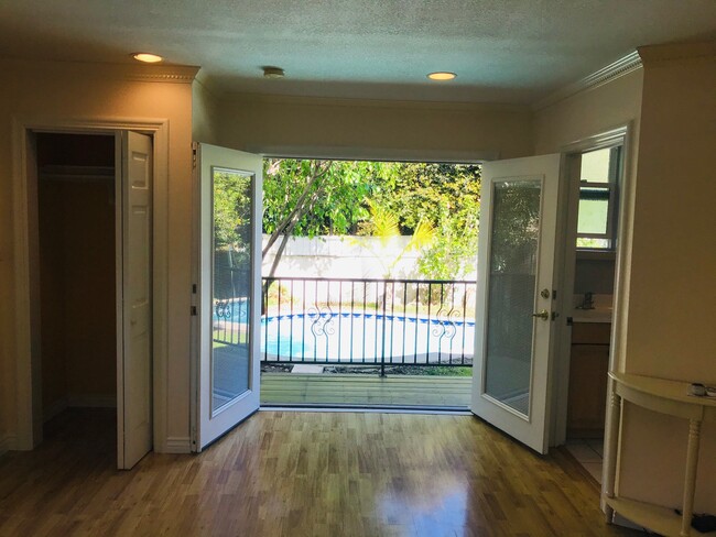 Interior with French Doors Open Bathroom at Right - 2627 Manning Ave