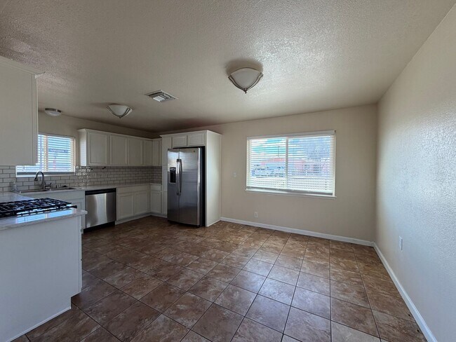 Building Photo - 3 Bedroom 2 Bathroom House with Central A/C , 2 Car Garage and Beautiful Backyard with Covered Patio