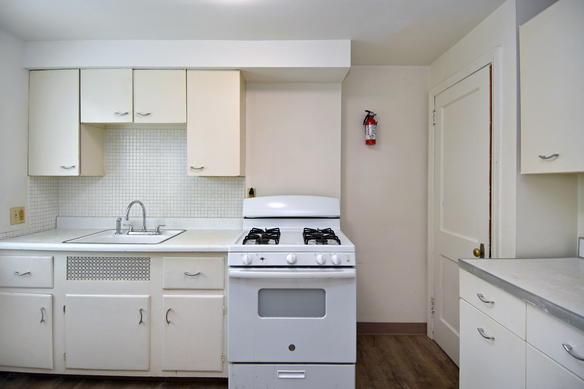 Kitchen with new luxury vinyl plank flooring and LED lighting - 210 E Garden Rd