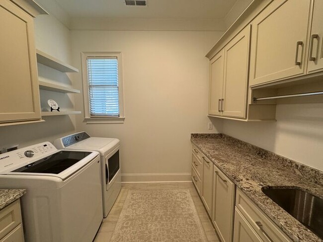 Building Photo - Rare rental opportunity in gated McMullen Cove community