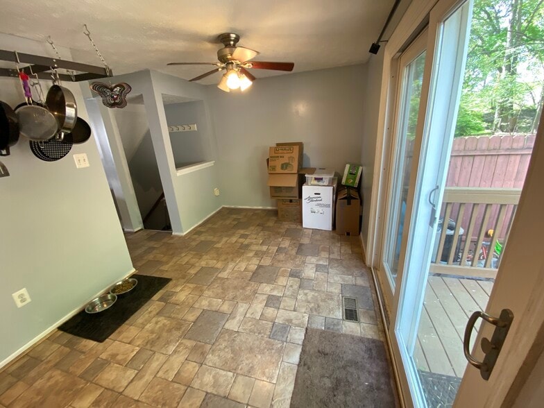 Dining room and rear door with deck. - 9006 Old Scaggsville Rd
