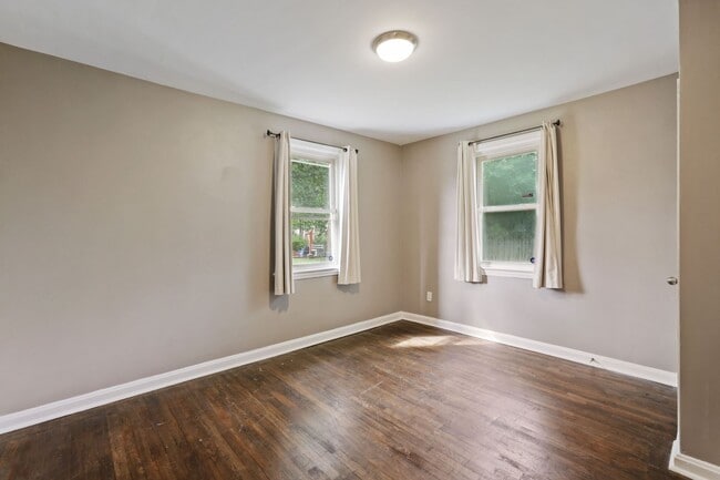 Building Photo - Move-In Ready Cape Cod with 3 Finished Levels & Huge Backyard