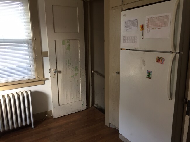 View of Kitchen and Stairs to Basement - 208 S Bassett St