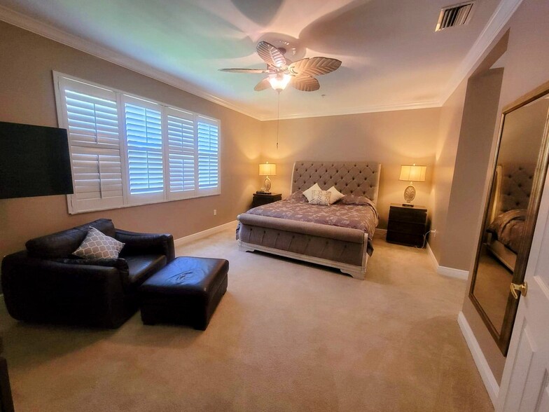 Master bedroom with King size sleigh bed and large walk-in closet - 16570 Goldenrod Ln