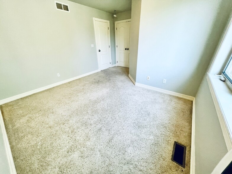 Bedroom on 2nd floor with en suite bathroom. - 2317 Decatur St