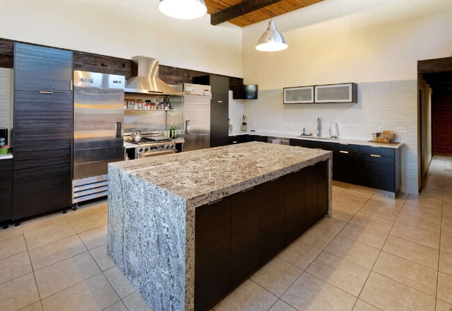 Building Photo - One-of-a-kind adobe brick home backing up ...