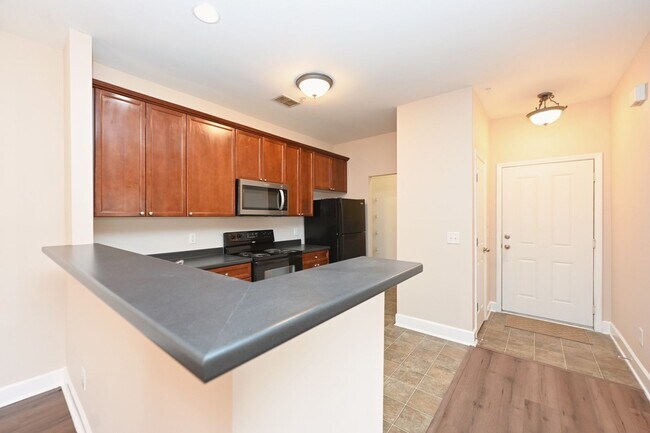 Building Photo - **PRISTINE GARDEN-LEVEL CONDO ON THE FIRST LEVEL NEAR PAVILION AND COMMUNITY GREEN SPACE**