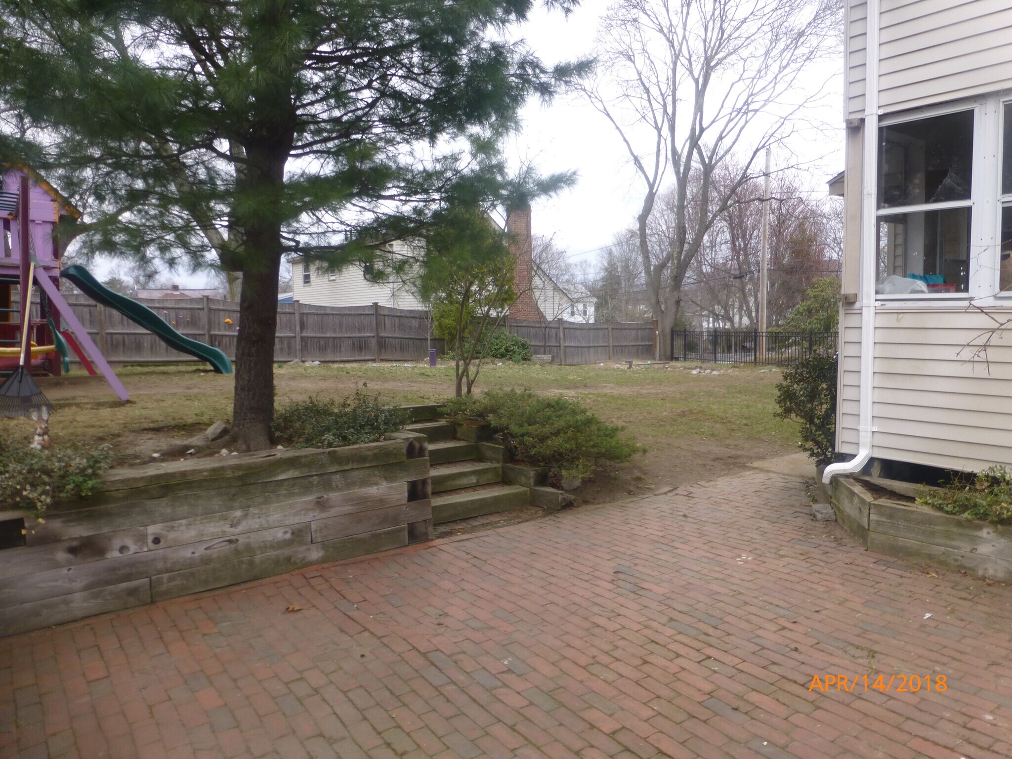 back-yard w/ patio - swing set has been removed - 43 Goethe St