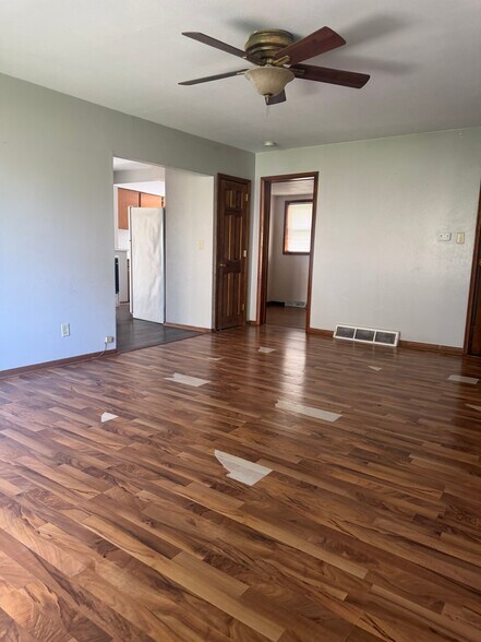 Living room - floor being replaced - 216 S. College Avenue