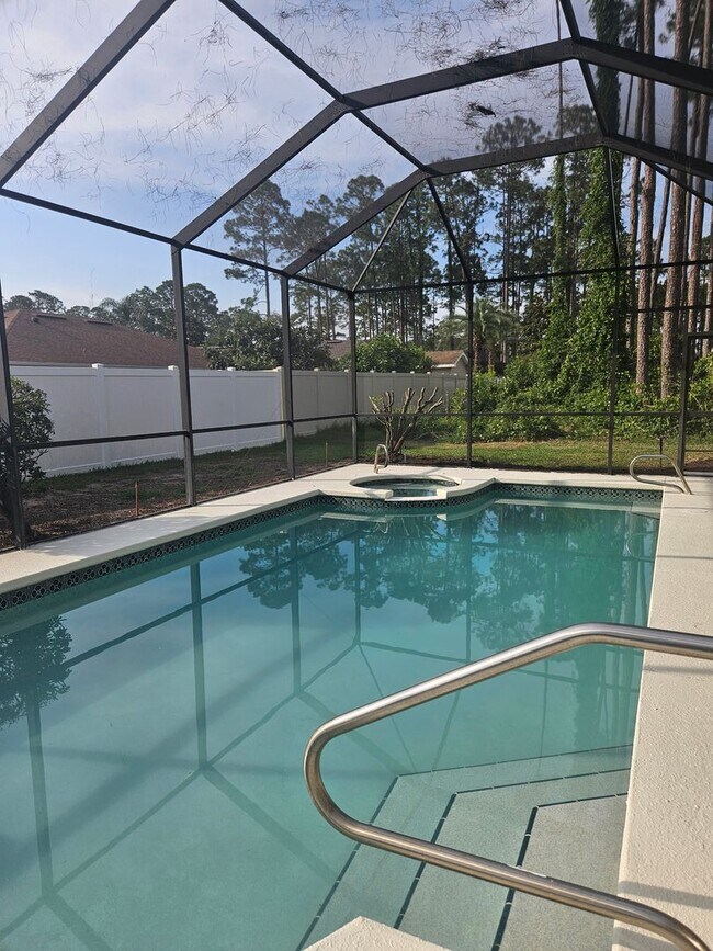 Building Photo - 4 BEDROOM 3 FULL BATH HOME WITH A SCREENED IN POOL IN THE BEAUTIFUL PALM COAST