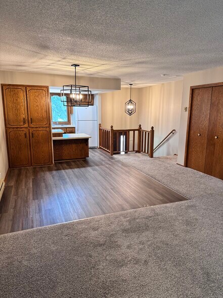 Dining area. Open stairway. - 3709 229th Ln NW