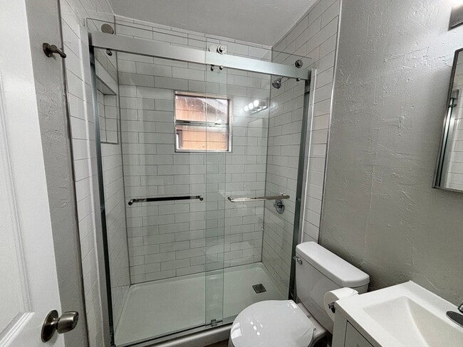 Building Photo - Remodeled 2 bedroom, 1 bathroom house with fenced yard and garage