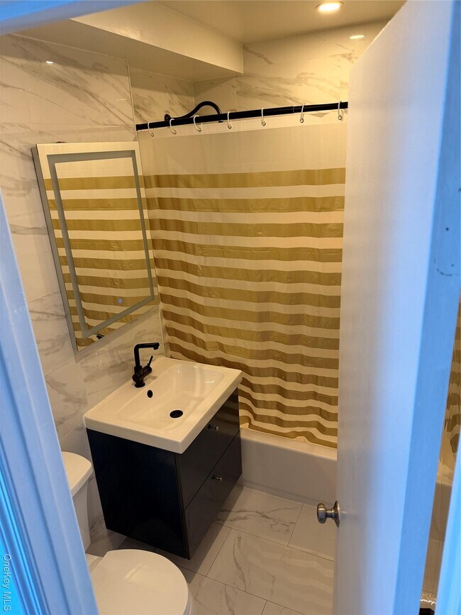 Building Photo - 55-12 Main St