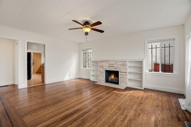 Spacious living room with lot of light. So much room! - 2108 E 23rd St