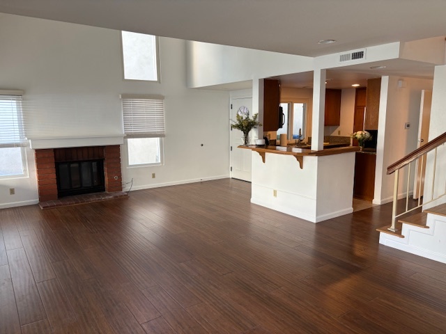 An open concept living and dinning room with fireplace! - 8724 Edmonton Pl