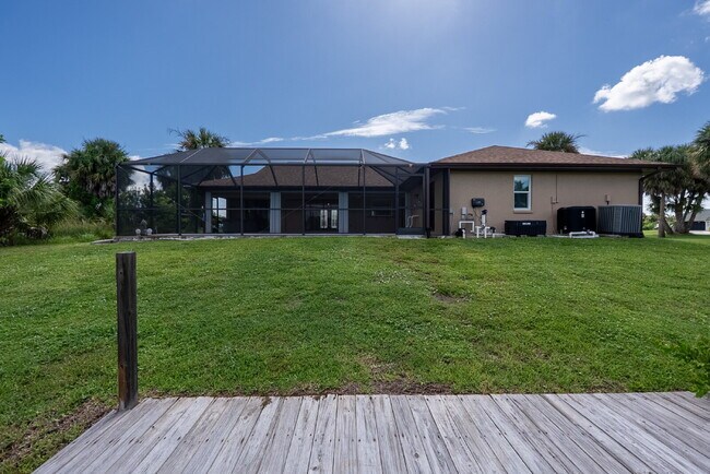 Building Photo - 3 BEDROOM • 2 BATHROOM • PRIVATE POOL • WATERFRONT • BOAT LIFT • ZERO DEPOSIT MOVE-IN AVAILABLE
