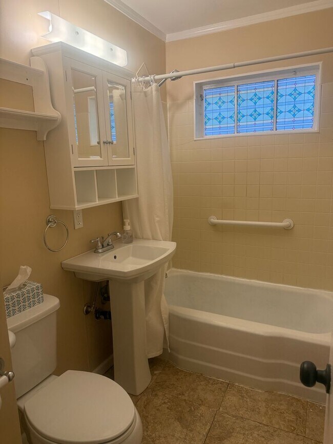 Building Photo - Step into this beautifully updated 1950's gem, where charm meets modern convenience