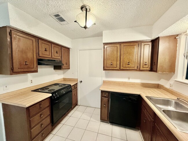 Building Photo - Charming 3BR/2BA Brick Home in Perkins Village – Spacious Yard & Cozy Fireplace