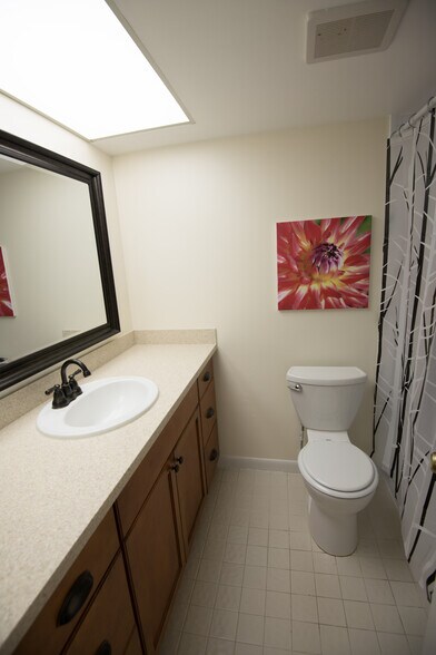 Remodeled guest bathroom with Corian countertop. - 1291 SE Parkview Pl