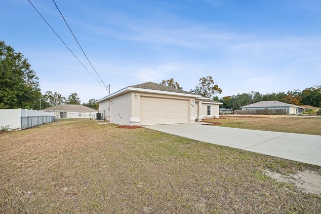 Building Photo - Fenced & Tiled 3/2/2 Summerfield Home For ...