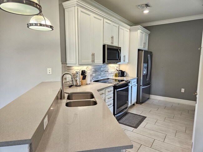 Building Photo - Stunning Model Home – 2 Bedrooms plus Den,...
