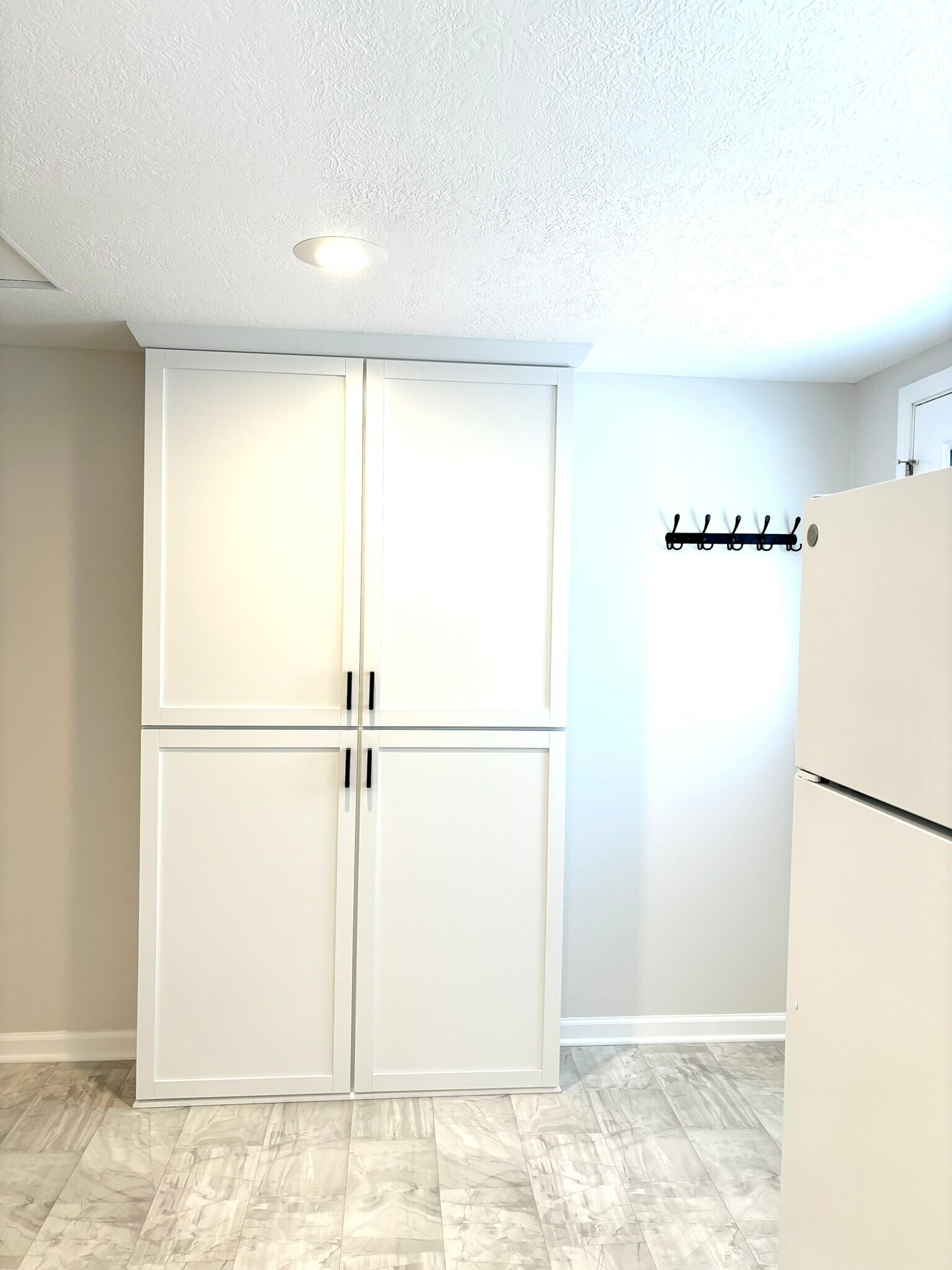Kitchen pantry and coat hooks - 9841 Cleveland Ave NW