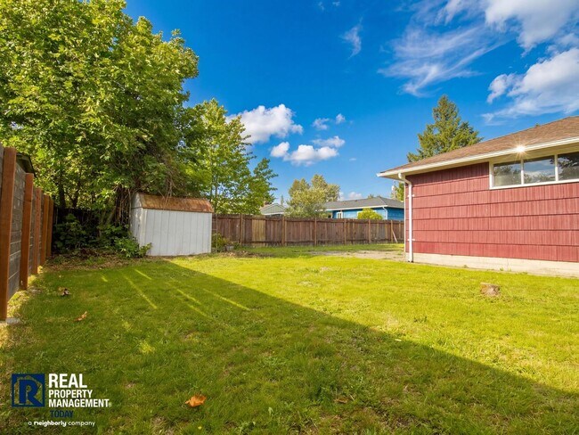 Building Photo - Charming Tacoma Home with Huge Fenced Yard, Garage & Hardwood Floors