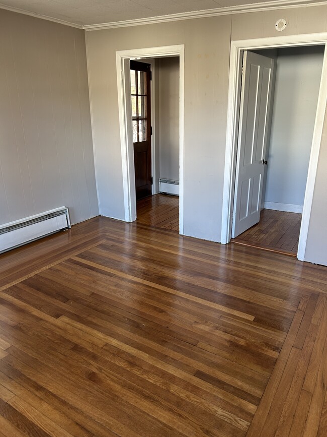 Living room looking towards from door on left and stairs to bedrooms on right - 36 Niles Rd