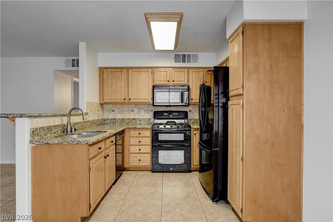 Building Photo - 5710 E Tropicana Ave