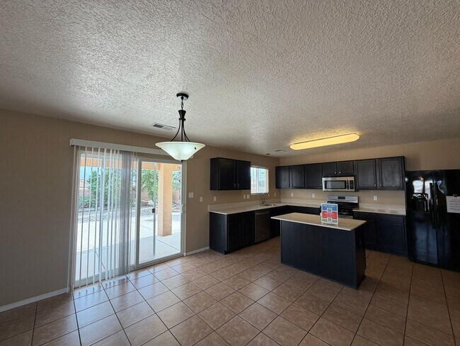 Building Photo - 4 Bedroom Home Available Near McMahon Blvd NW & Universe Blvd NW!