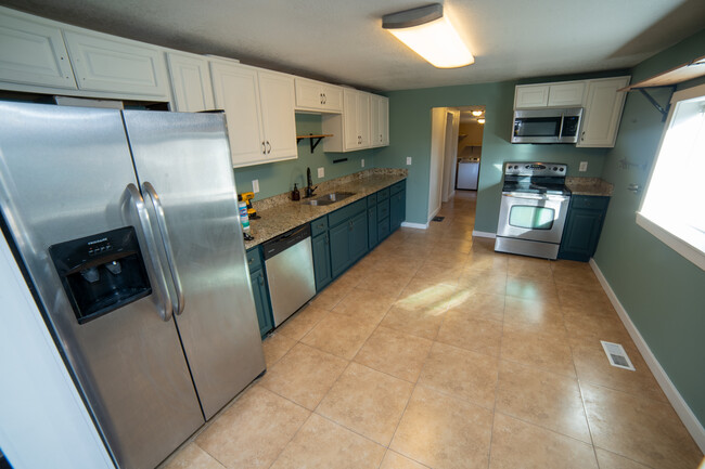 Kitchen with lots of space for cooking, entertaining. Refrigerator is new as of last year. - 5410 Monaco St