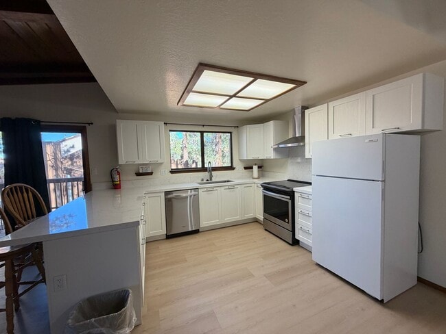 Building Photo - Tri-Level Lake Village Condo with Upgrades