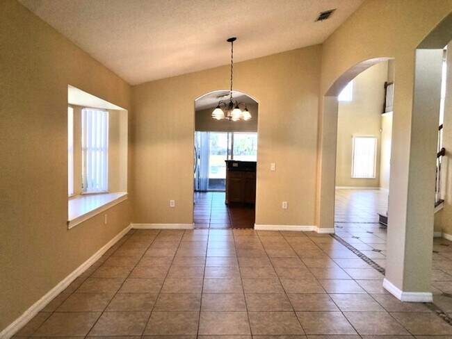 Building Photo - EAGLE CREEK LAKE NONA! WELCOME HOME! Beautiful water views! Spacious 2 story-3 bedroom 2.5 bath h...