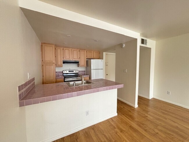 Building Photo - Spacious 1BD/1BA Mission Plaza Condo with Resort-Style Amenities in Prime Mission Valley Location