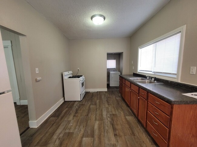 Building Photo - Two bedroom home with partially fenced yard!