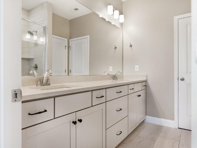 Building Photo - The Towns on Greenway! Two bedrooms. Two private baths, Half Bath. Greenway around the corner. Up...