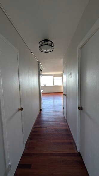 Hall including two additional linen closets (door on left and second door on right). - 6301 N Sheridan Rd