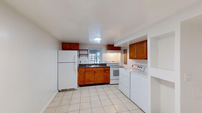 Building Photo - Four Bedroom 2,500 Square Foot House W/Back Patio, Multiple Kitchens/Laundry Facilities