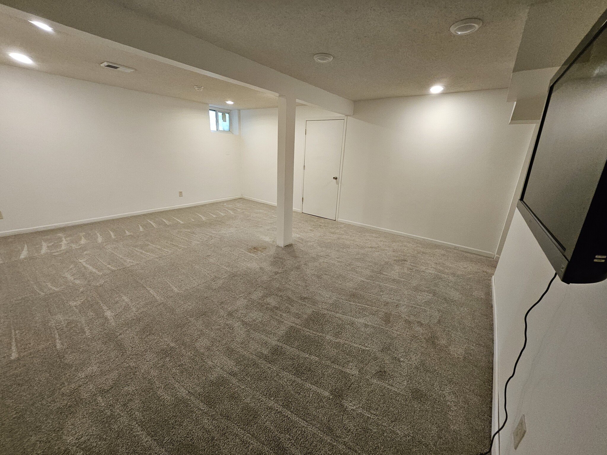 Large 15.6' X 19.6' lower level family room provides space for everyone to relax. - 2353 Mailand Ct E